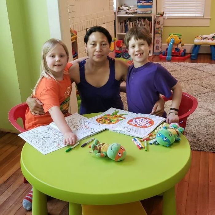 About - Flori with two students-min