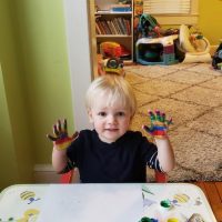 Methodology - Happy student doing an art activity-min